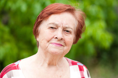 Redhead senior woman at park