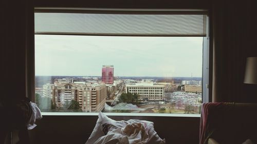 Scenic view of city through window