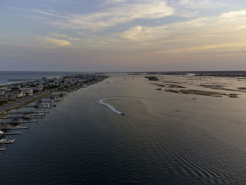 Scenic view of sea against sky at sunset