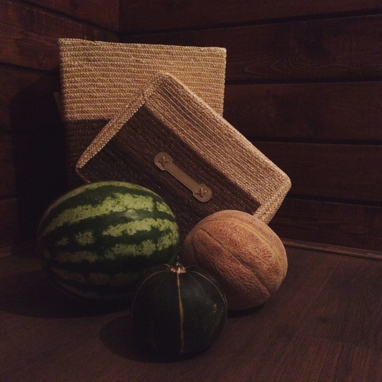 indoors, still life, table, wood - material, close-up, wooden, no people, art and craft, home interior, high angle view, single object, wall - building feature, art, creativity, selective focus, focus on foreground, old, decoration, pattern, brown