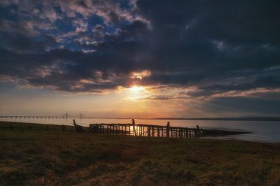 Scenic view of beach against sky during sunset