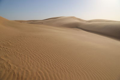 Scenic view of desert against clear sky