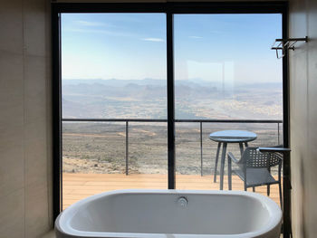 Scenic view of sea seen through glass window