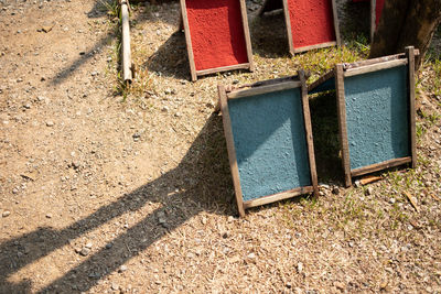 High angle view of telephone booth on field during sunny day