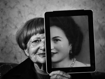 Portrait of young woman using mobile phone