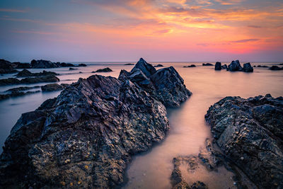 Scenic view of sea against sky during sunset