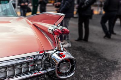 Close-up of vintage red car on street