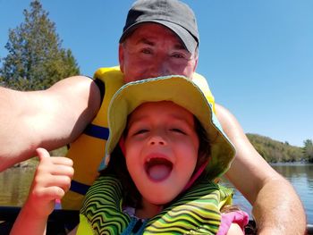 Portrait of cute baby boy against sky