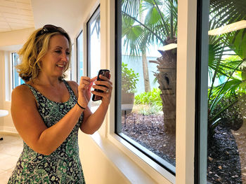 Business woman on cell phone in modern startup office.