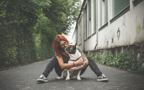 Full length of woman with dog