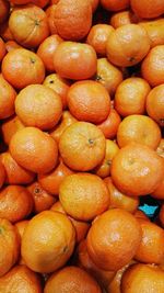 Full frame shot of oranges at market stall