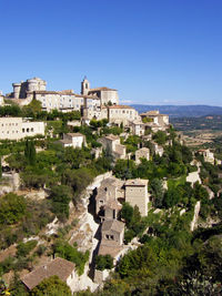 High angle view of cityscape against clear blue sky