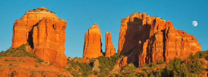 Panoramic view of rock formations against sky