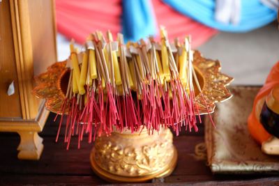 High angle view of lit candles on table in temple