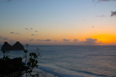 Scenic view of sea against sky at sunset