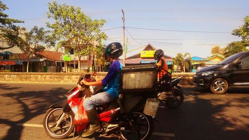 Bicycles parked on road against sky