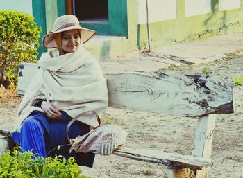 Portrait of a woman sitting outdoors