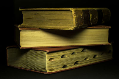 Close-up of books against black background