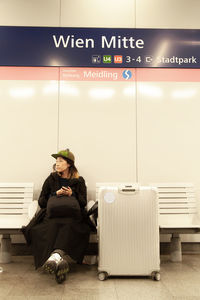 Man sitting on bench in bus