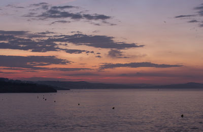 Scenic view of sea against sky at sunset