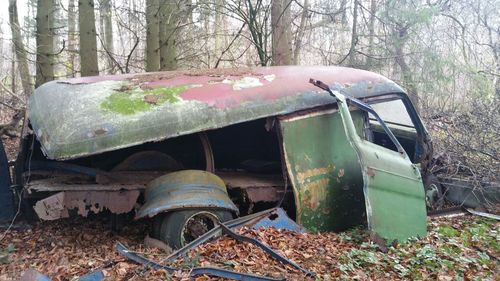 Abandoned boat in forest