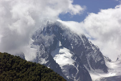 Low angle view of majestic mountains against sky