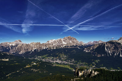 Scenic view of mountains against blue sky