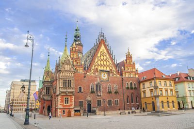 Buildings in city against sky