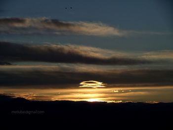 Scenic view of dramatic sky during sunset