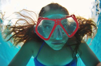 Portrait of woman wearing swimming goggles