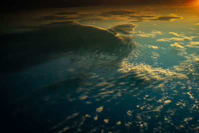 Aerial view of sea against sky during sunset