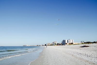 Scenic view of sea against clear blue sky