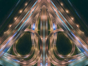 Digital composite image of light trails on highway at night