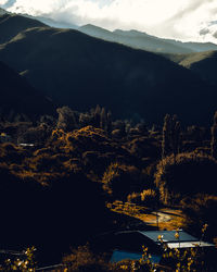 Scenic view of illuminated mountains against sky