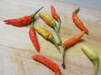 Close-up of red chili peppers on table