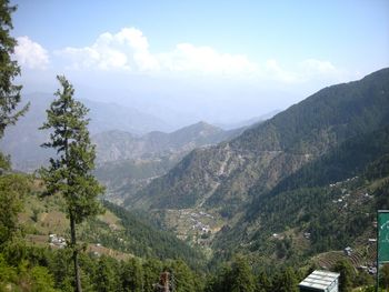 Scenic view of tree mountains against sky