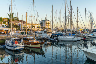 Boats moored at harbor