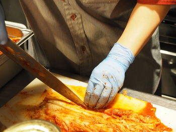 Close-up of man preparing food