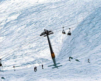 High angle view of ski lift on snowcapped mountain