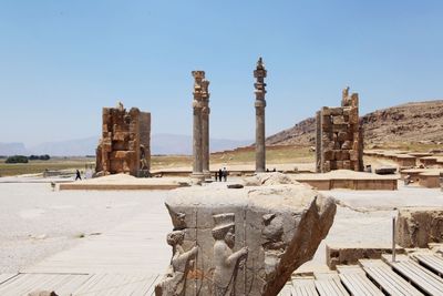 Old ruin at persepolis against clear sky