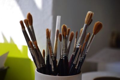 Close-up of paintbrushes on table