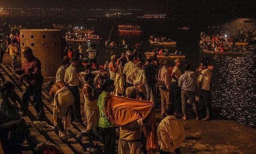 Rear view of people at music concert at night