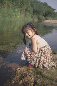 Portrait of smiling girl in lake