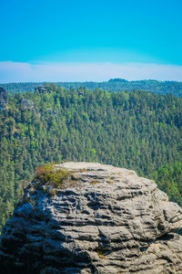 Scenic view of rocky mountains against clear blue sky