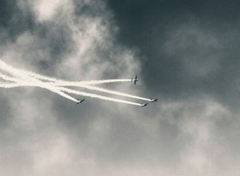 Low angle view of airplane flying in sky