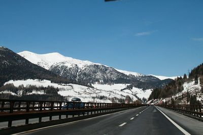 Scenic view of snow covered mountains against sky