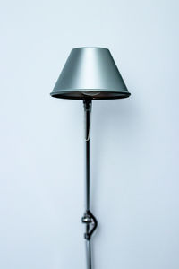 Close-up of electric lamp against white background