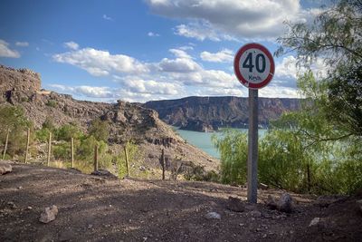 Road sign against clear sky