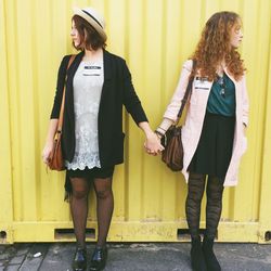 Rear view of a young woman standing outdoors