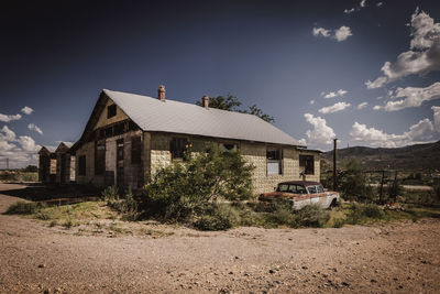 Abandoned house against sky in the desert